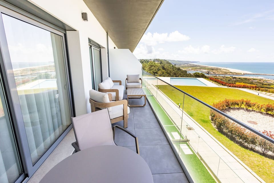 2-bedroom apartment in Pederneira with sea view balcony, pool, and peaceful setting, just minutes from Nazaré beach and town center.