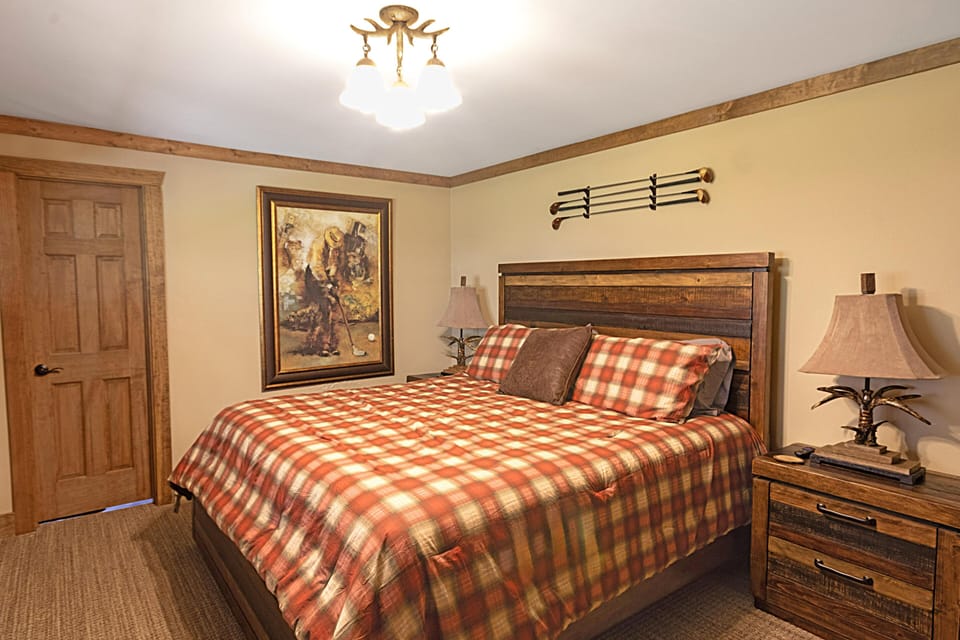 The cozy first bedroom with a king bed.