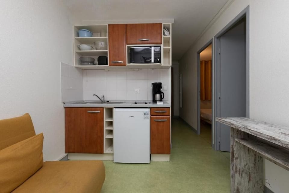 Standard Apartment, 1 Bedroom | Living area | Flat-screen TV, table tennis