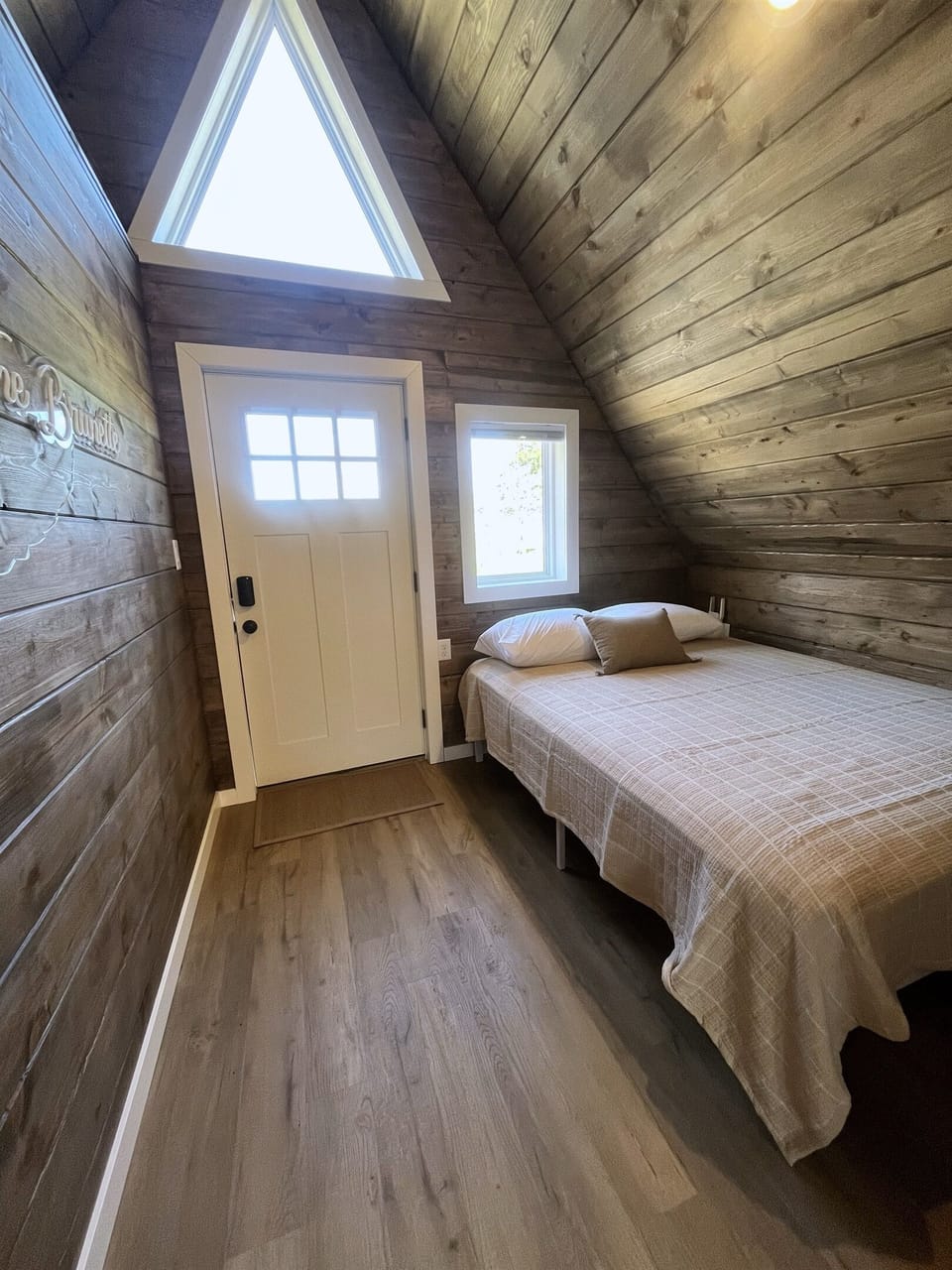 Front entrance and queen bed