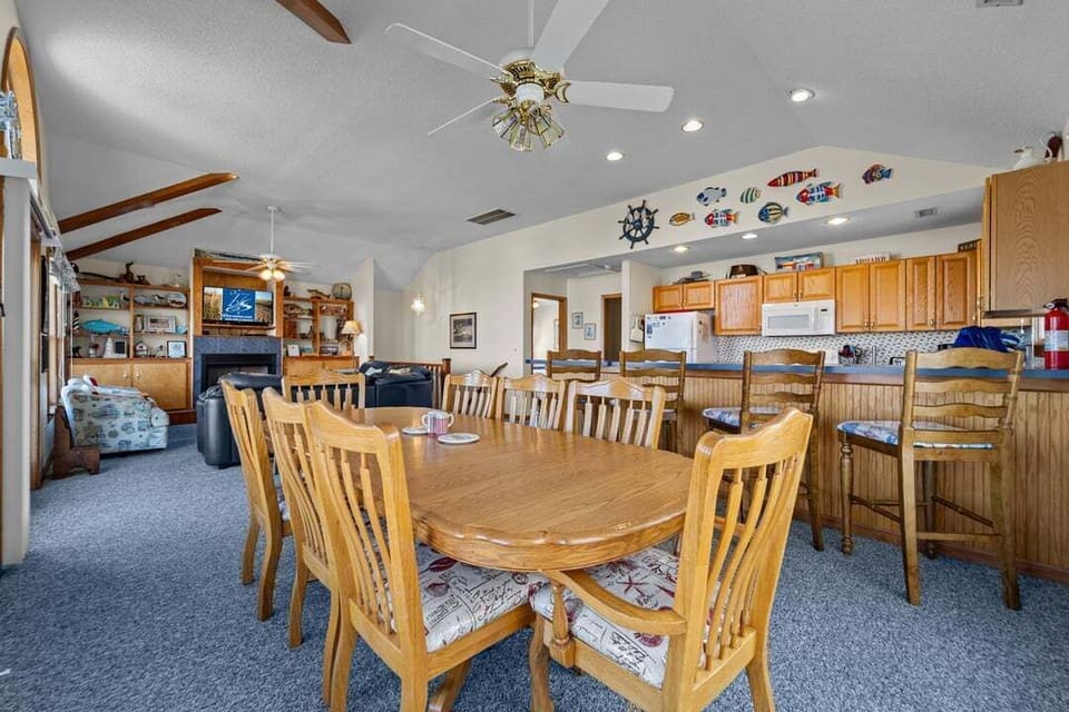 Top-Level Dining Room with Table (seats 8) and Deck Access