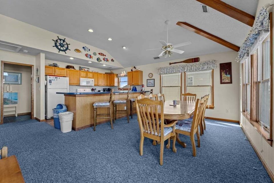 Top-Level Dining Room with Table (seats 8) and Deck Access