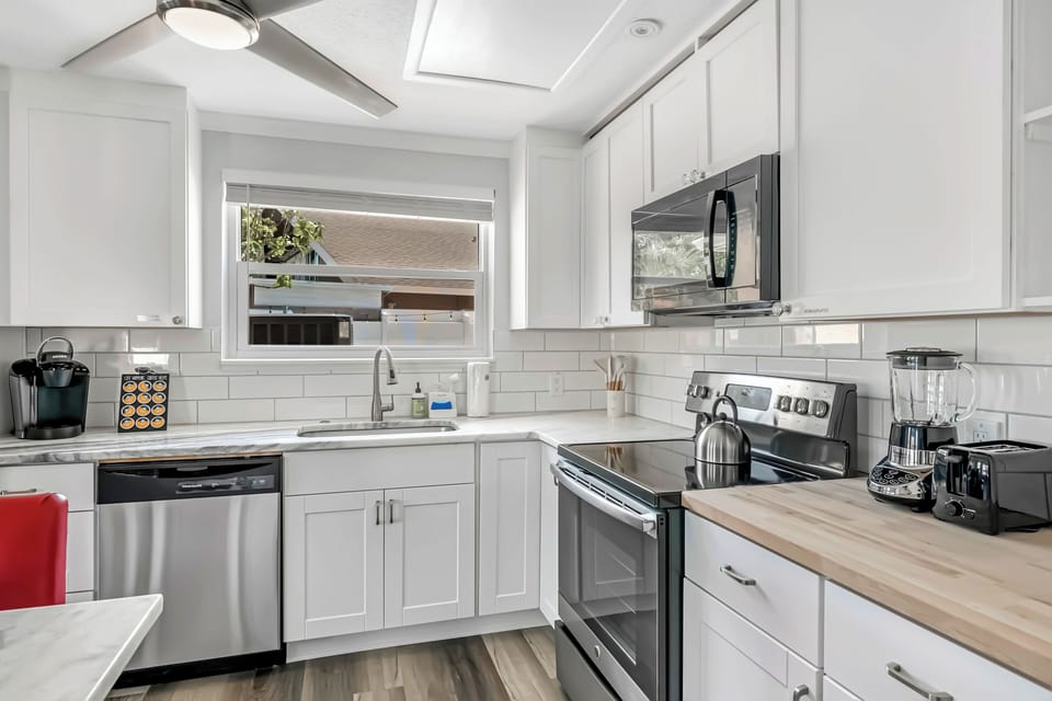 Ocean Away Home | Kitchen | Stainless Steel Appliances | Cooking Utensils.
