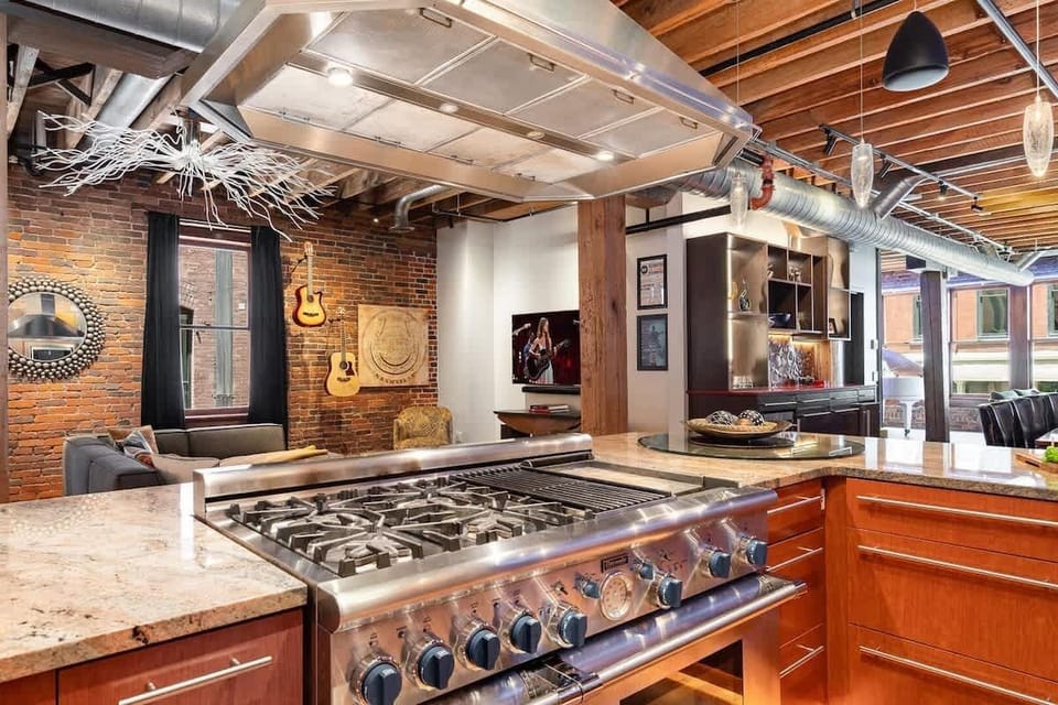 Fully Equipped Kitchen featuring stainless steel, open counter space, and bar seating for 3 guests.