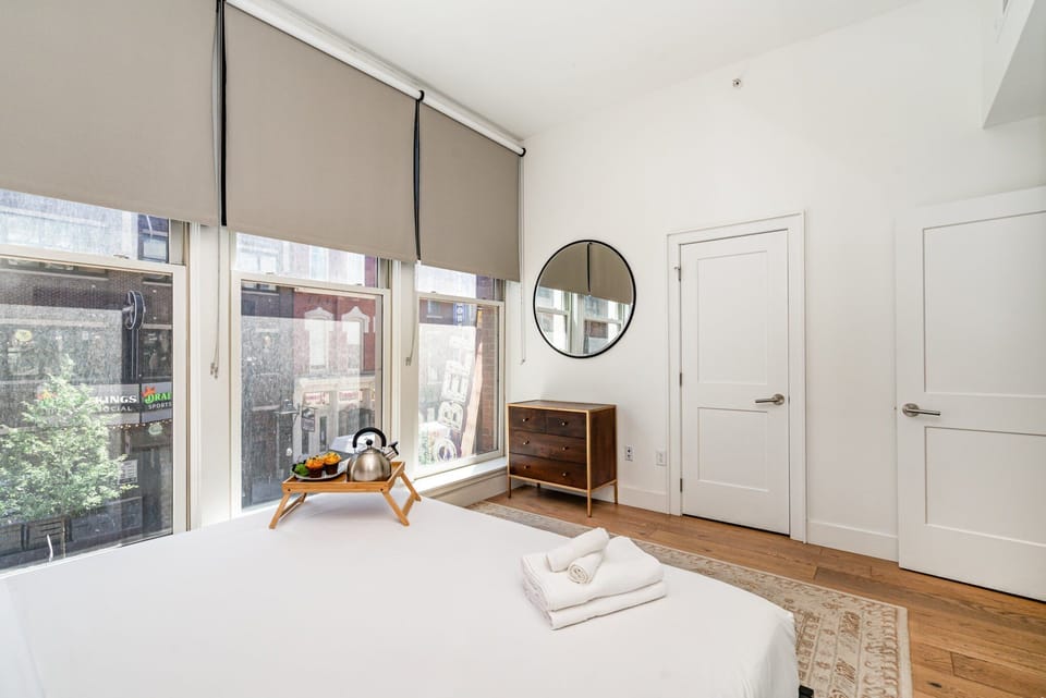 Unit 1: 2nd bedroom featuring a King bed, closet, and dresser.