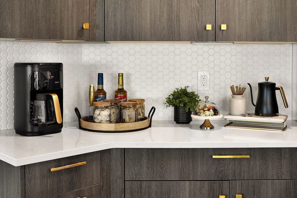 Cozy up with your favorite blend—this inviting beverage nook is stocked with coffee, artisan teas, hot chocolate, flavored syrups, and all the fixings for the perfect comforting sip.