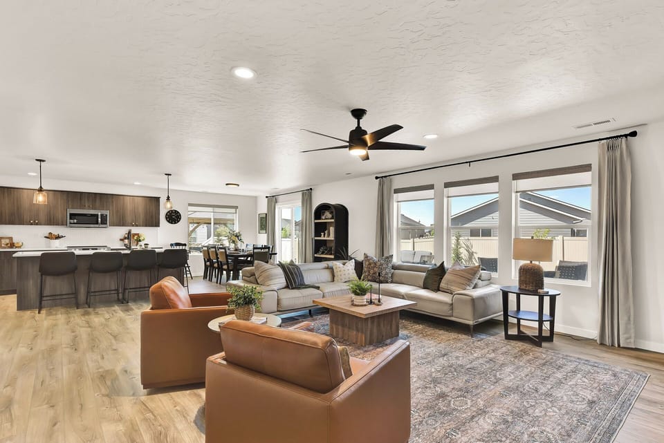 Spacious, sunlit, and designed for connection—this open-concept living and kitchen area is where meals, memories, and morning coffee all come together.