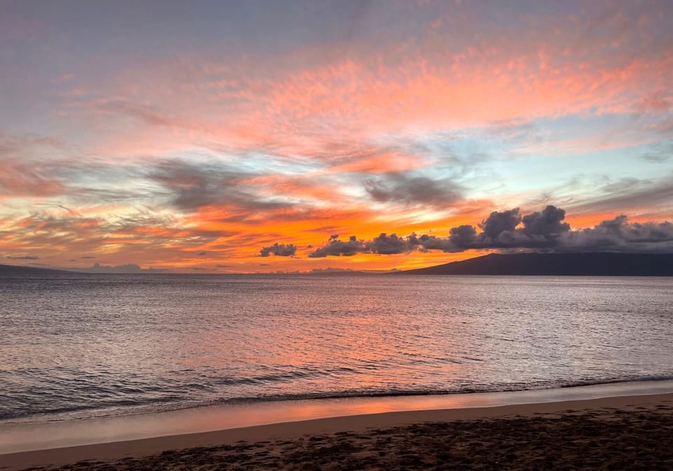 As day fades, the sky ignites—this breathtaking Maui sunset wraps the shoreline in a painter’s dream    MKV-B247