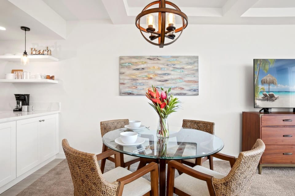    A chic blend of rattan texture, oceanic hues, and sculptural lighting create a breezy, coastal dining experience  WH1-1218