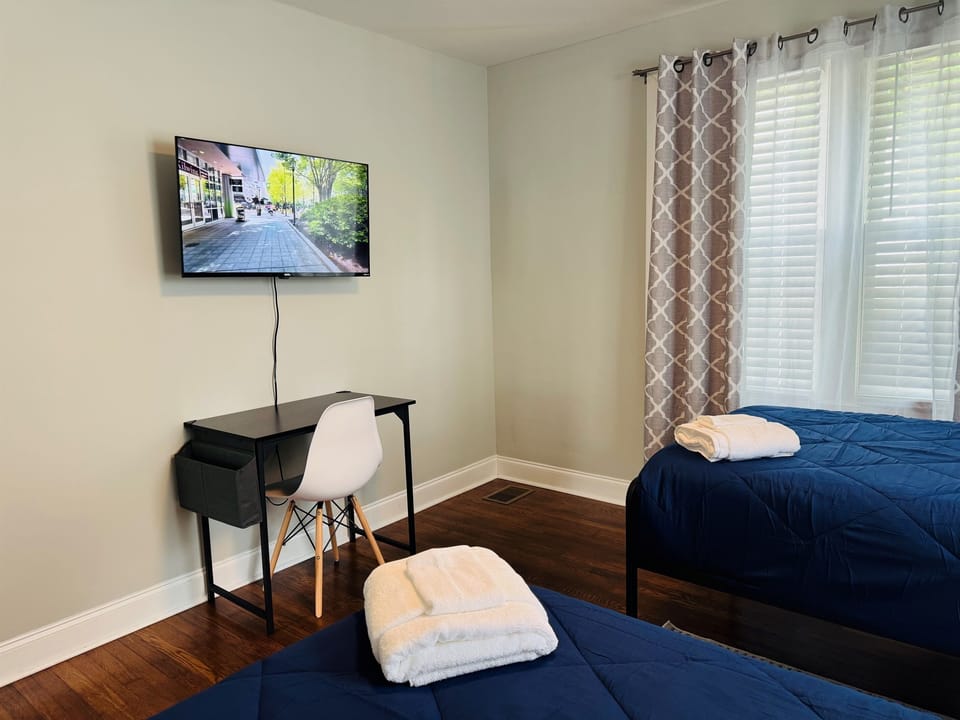 Room 3 with 43 in Smart TV and desk space.