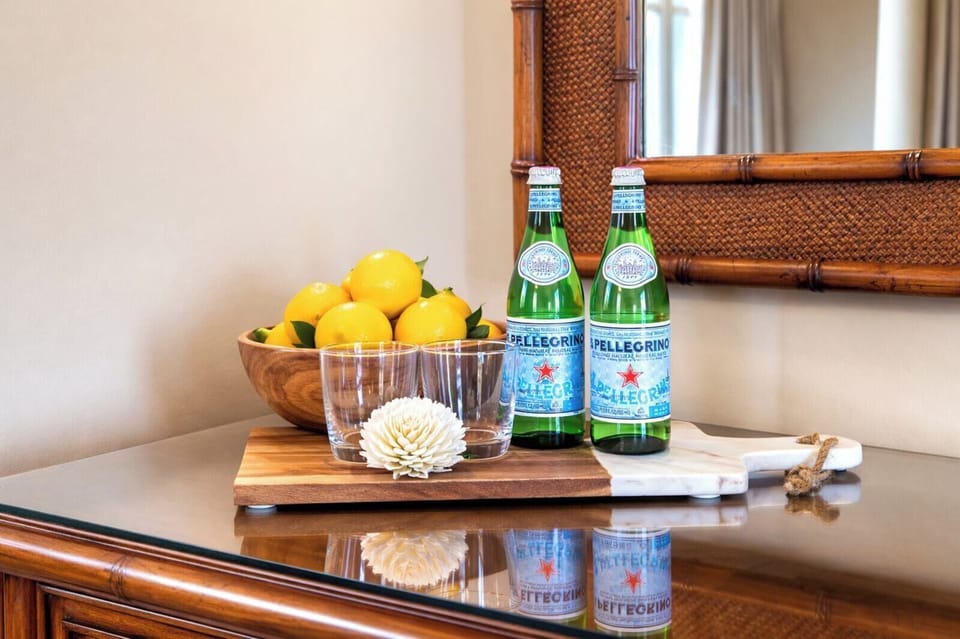 Granite countertops and polished finishes add a refined touch to your kitchen workspace, where preparing snacks or cocktails feels effortless. HKH-515
