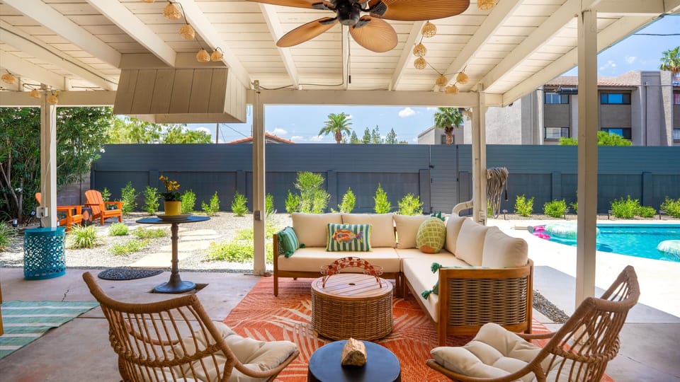  This chic covered patio offers the perfect blend of resort-style comfort and family-friendly charm.  Relax, connect, and enjoy poolside moments in total comfort.