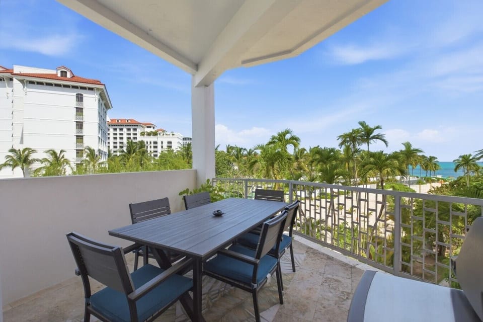 Private Balcony With Ocean View, Comfy Seating, and BBQ Grill
