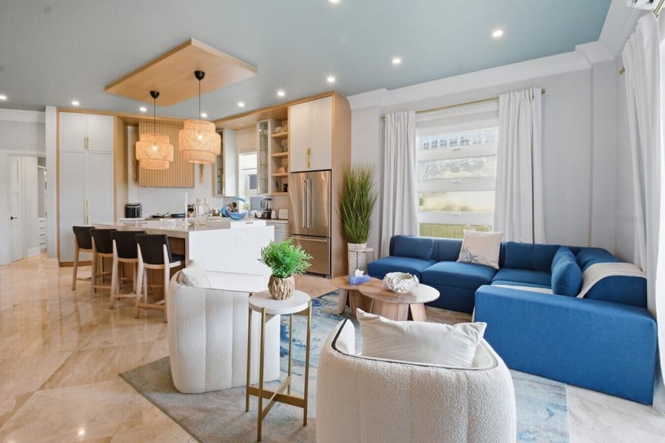 Spacious coastal-inspired layout with seamless flow from kitchen to living and dining — comfort meets style by the sea