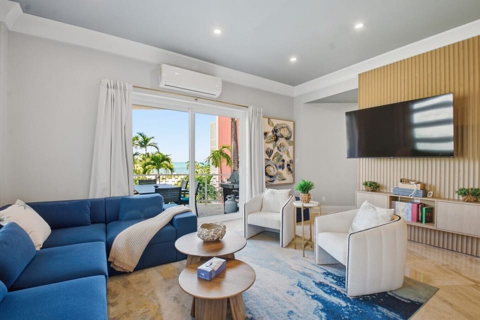 Spacious coastal-inspired layout with seamless flow from kitchen to living and dining — comfort meets style by the sea