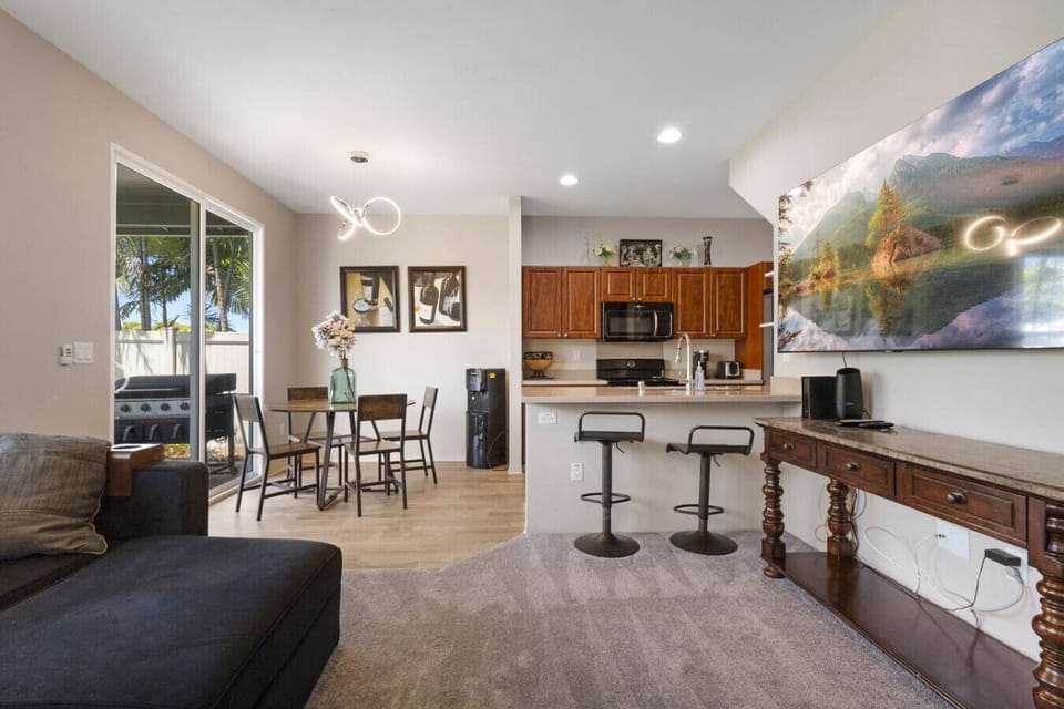 Open space featuring both bar seating and a cozy dining area—perfect for meals, entertaining, or relaxing with friends and family.