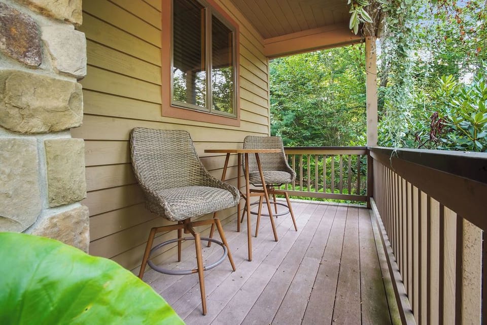 Start your day right with a cup of coffee on this inviting front porch.