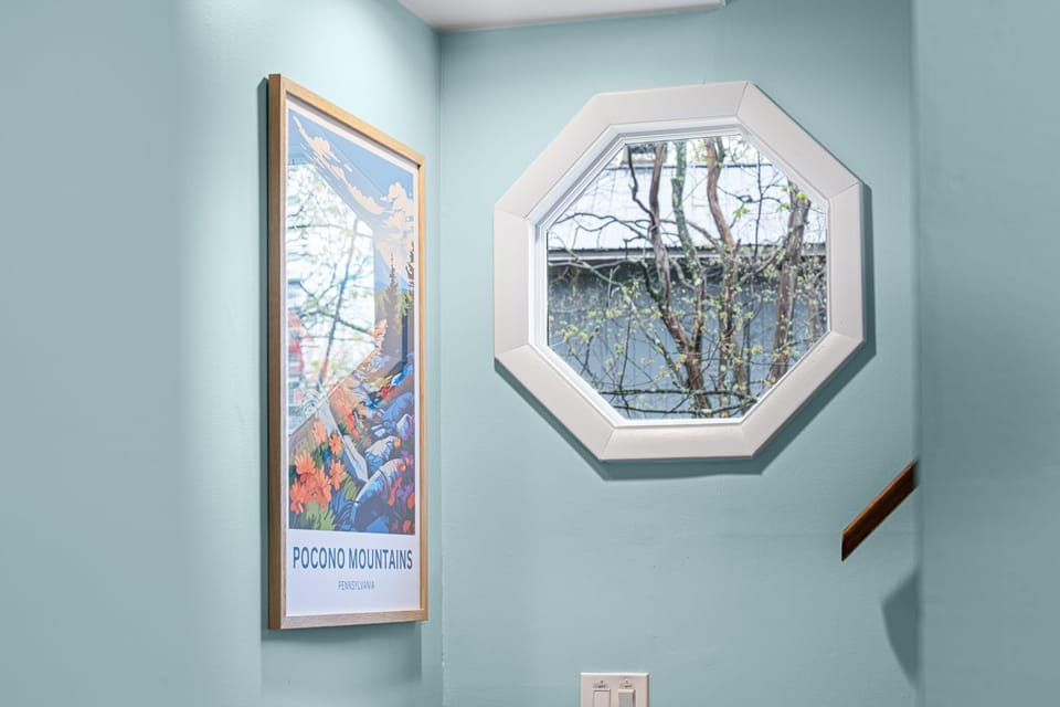 Mountain-inspired art and natural light accents.