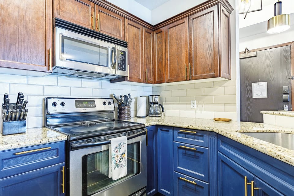 A well-appointed kitchen with plenty of cabinets, perfect for longer stays.