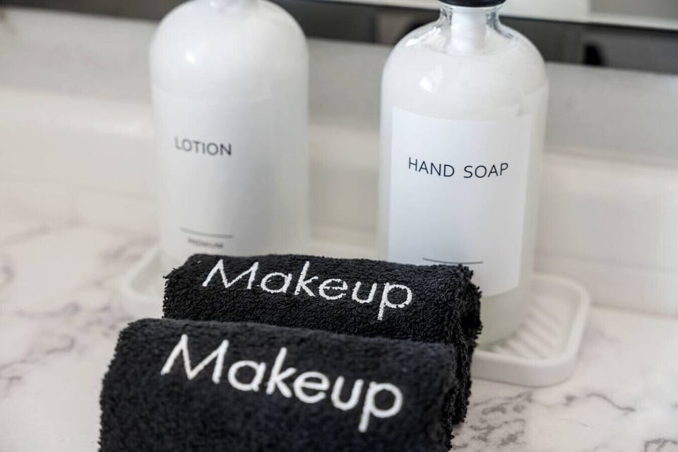 Thoughtful bathroom touches with makeup towels, hand soap, and lotion for a comfortable, worry-free stay