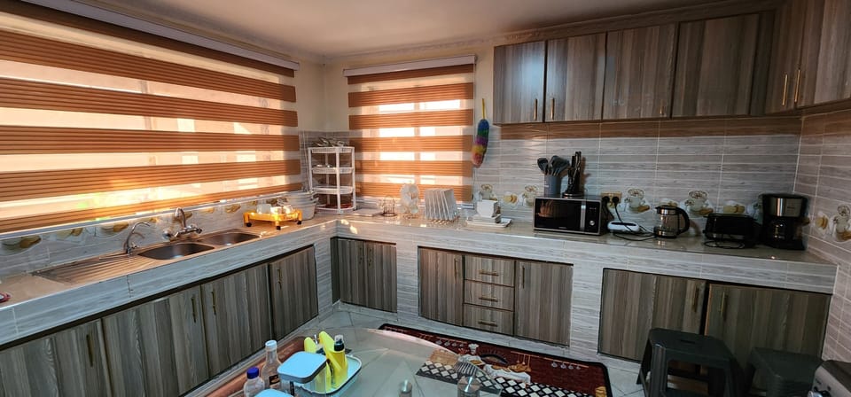 Family Bungalow | Private kitchen | Fridge, microwave, cookware/dishes/utensils