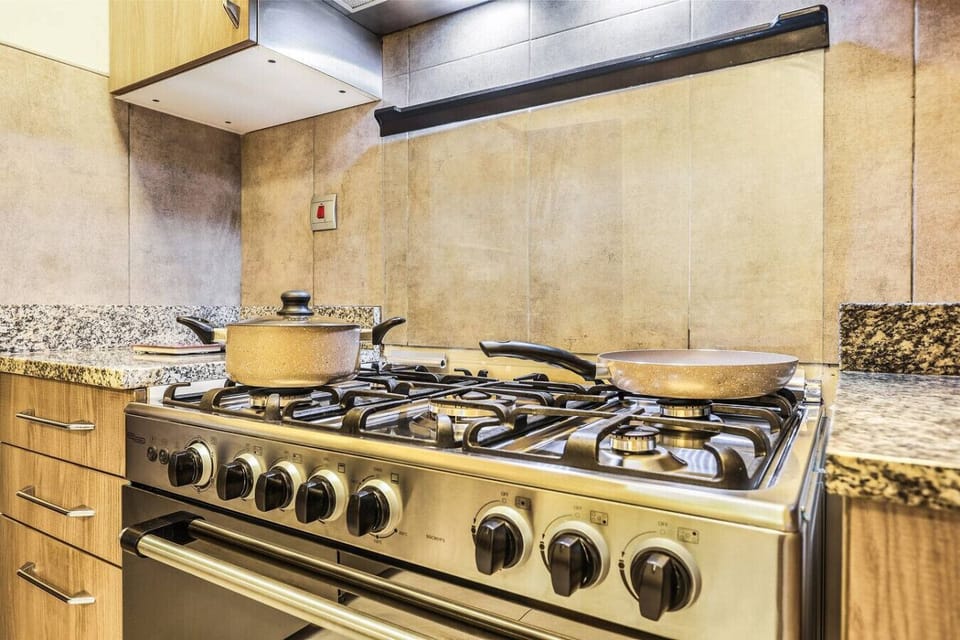 Kitchen: Cook up a storm in this modern kitchen featuring sleek appliances and ample counter space!