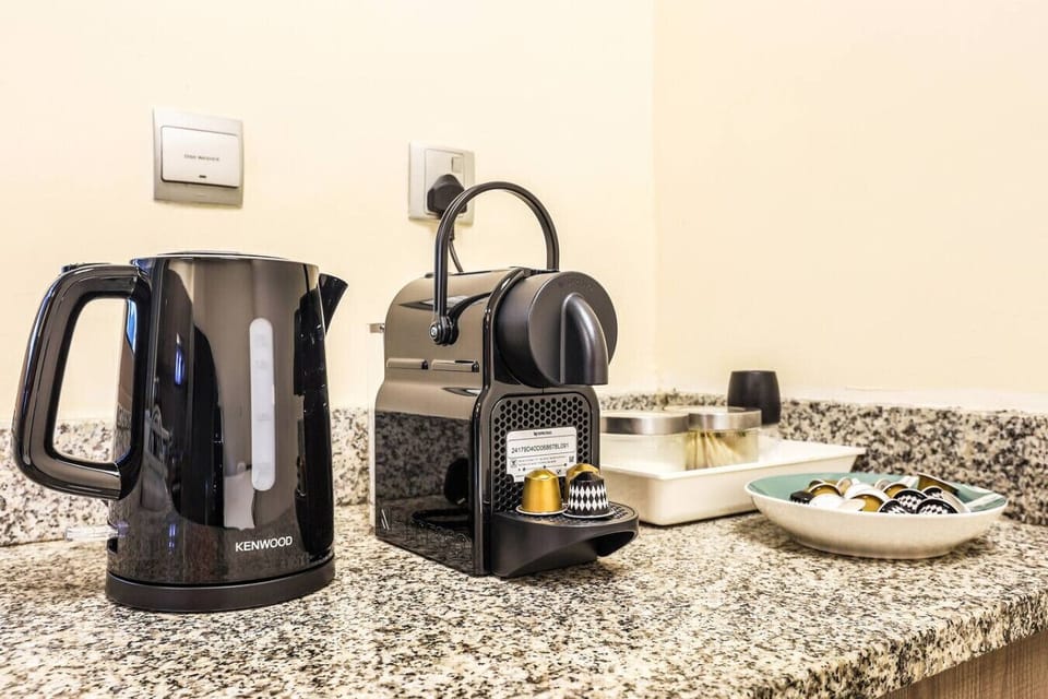 Coffee Corner: Brew your perfect cup in style with sleek appliances and gourmet pods at hand!