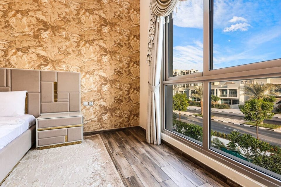 Bedroom Bliss: Natural light streams in, accentuating elegant decor and vibrant views of Dubai!