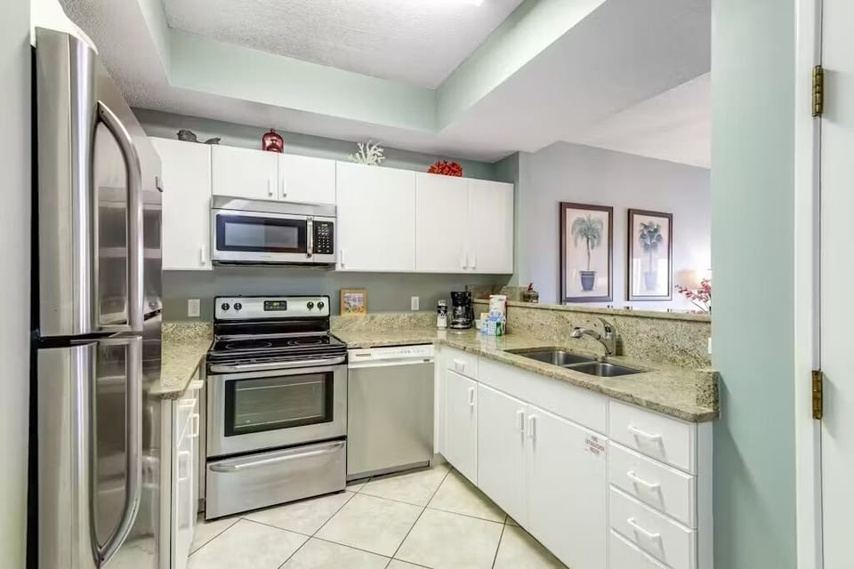 Your fully equipped kitchen awaits with stainless steel appliances, granite counters, and everything needed to create memorable meals during your stay.