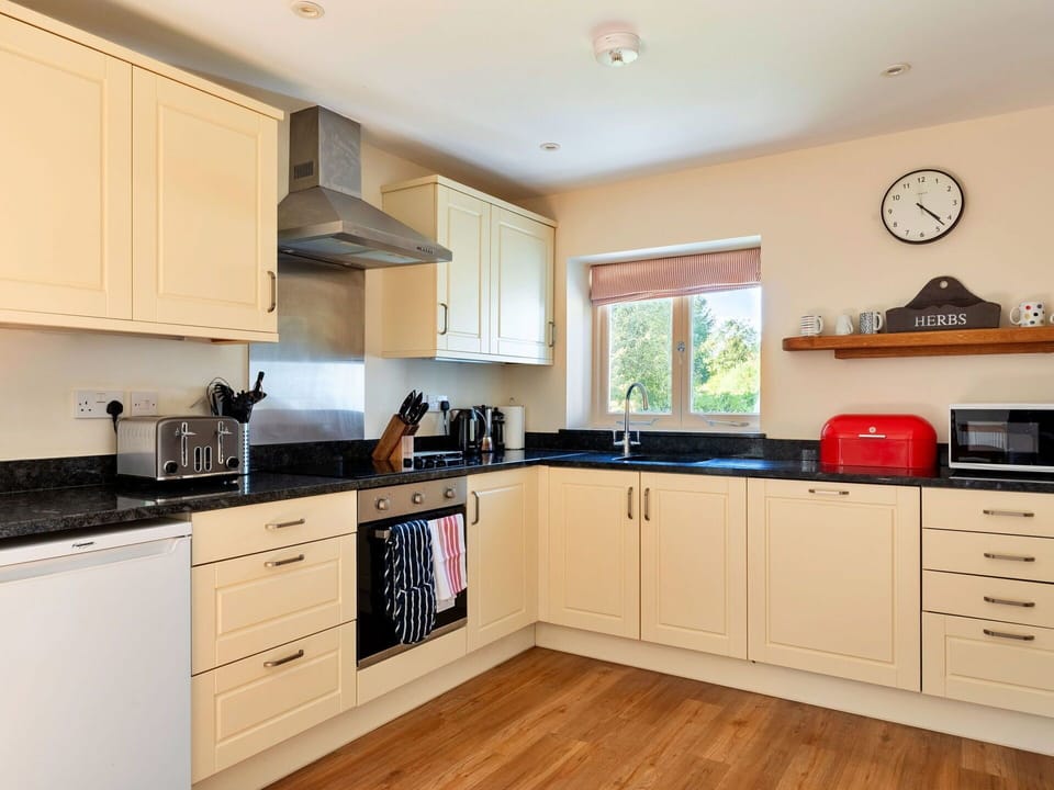 Kitchen, Kitchen Appliance, Countertop, Interior Design, Furniture, Flooring, Cabinetry, Major Appliance, Wood, Floor