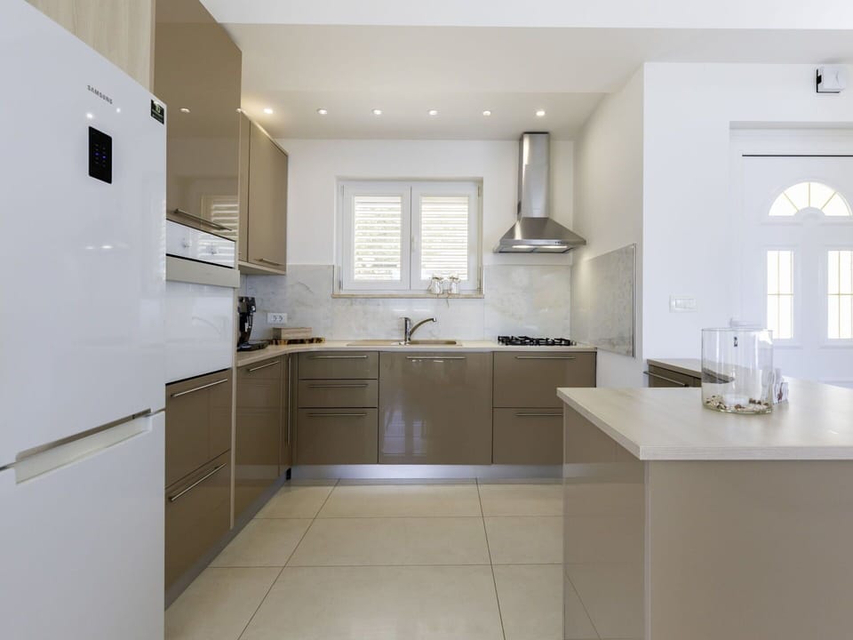 Kitchen, Kitchen Appliance, Furniture, Countertop, Cabinetry, Major Appliance, Flooring, Interior Design, Wood, Light Fixture