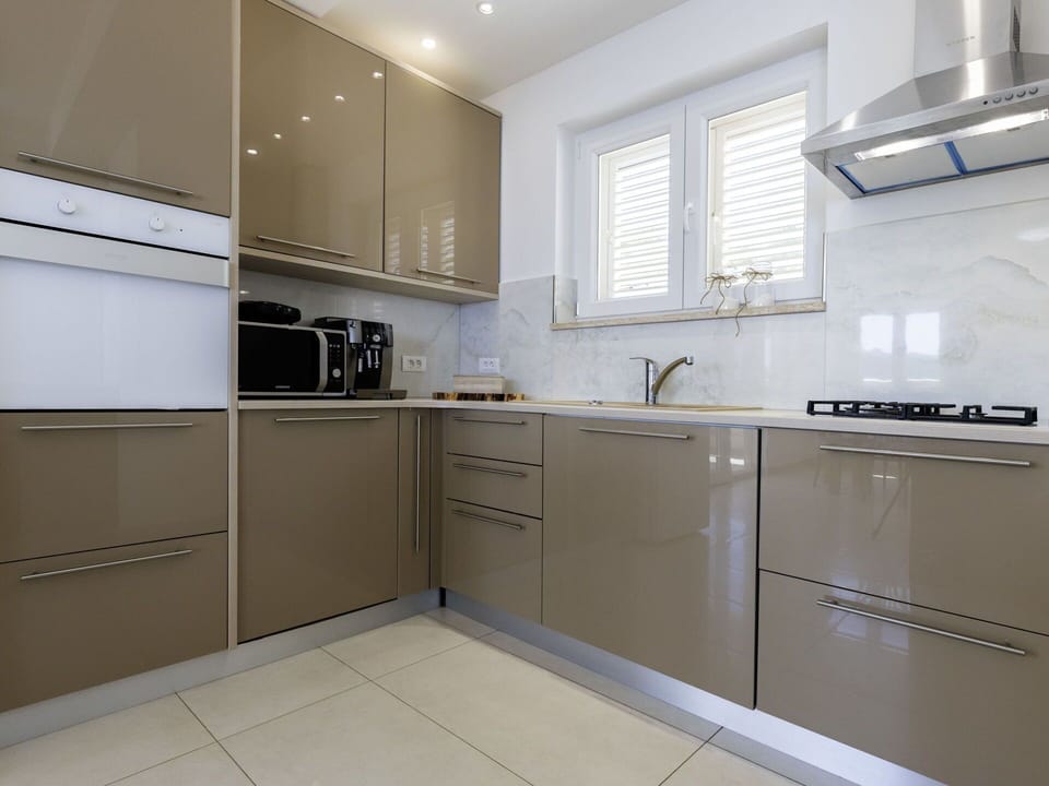 Kitchen, Kitchen Appliance, Cabinetry, Major Appliance, Countertop, Wood, Furniture, Flooring, Interior Design, Lighting