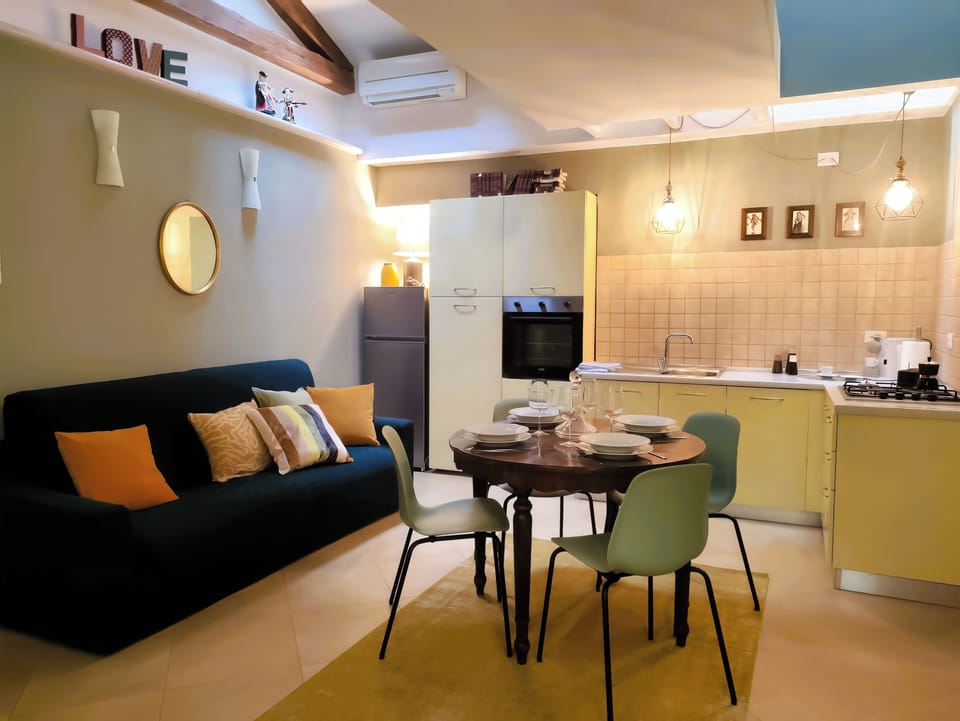 Open-plan kitchen & dining with stylish staircase to the roof terrace.