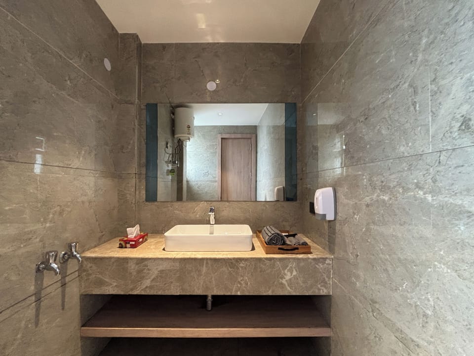 Studio, City View | Bathroom | Shower, free toiletries, slippers, towels