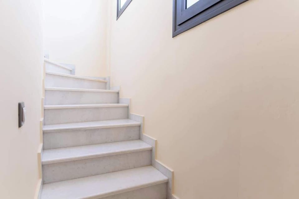 Bright stairway with natural light leading to upper-level comfort.