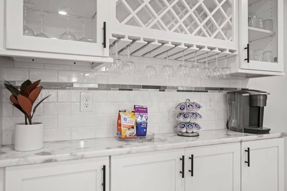 Coffee & Snack Bar | Glass Cabinetry, Wine Storage, and Coffee Station with Treats
