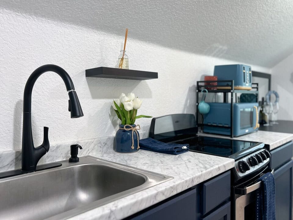 Modern Kitchenette | Marble Counters, Sleek Fixtures & Retro Appliances