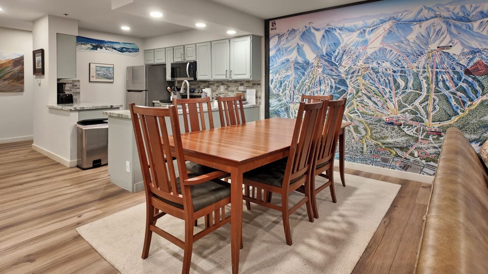 Warm dining space with mountain mural