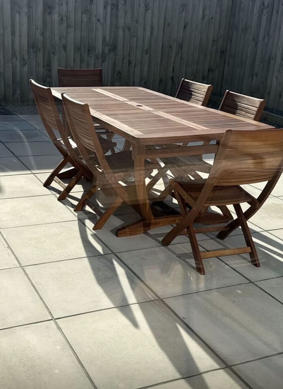 Gather your family around the timber dining table on your private patio—where sunny afternoons turn into unforgettable meals together.