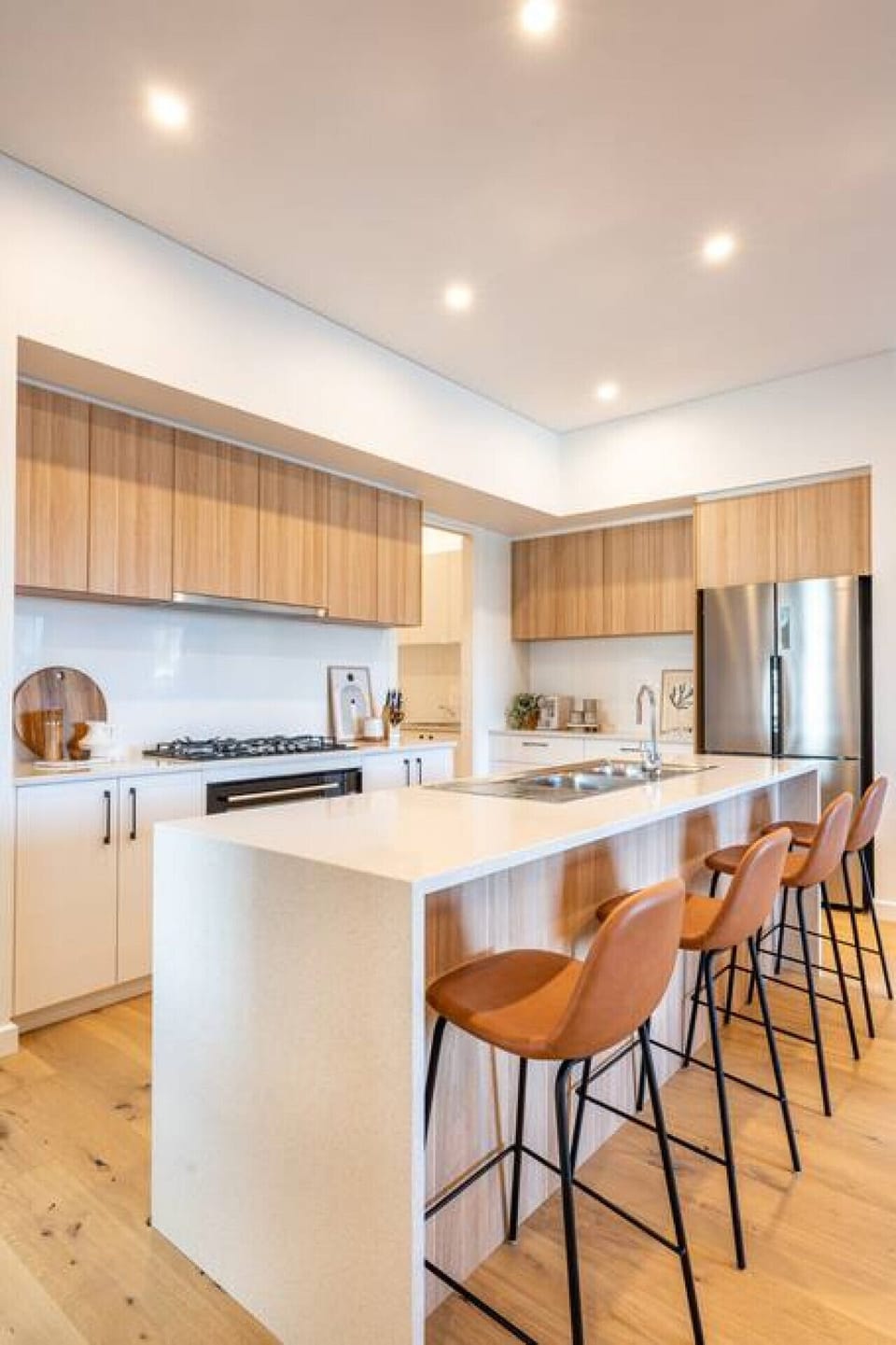 Cook with ease using modern appliances and plenty of bench space, whether it’s a quick breakfast or a shared dinner.