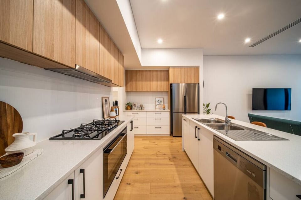 Prepare meals with ease in the sleek kitchen, complete with modern appliances and generous space.