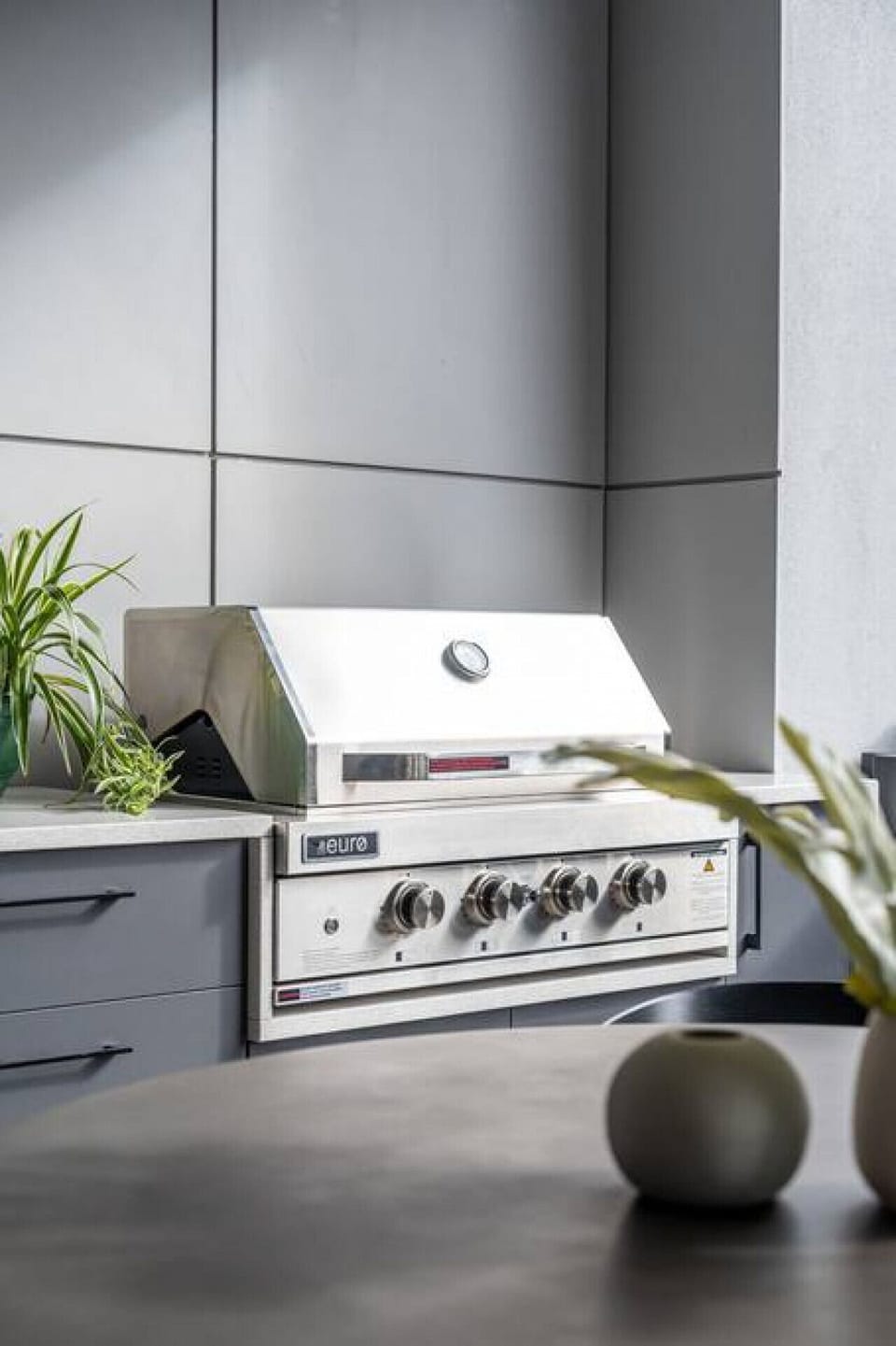 Cook and entertain with the built-in BBQ, sink, and wine fridge, ideal for laid-back gatherings in the open air.