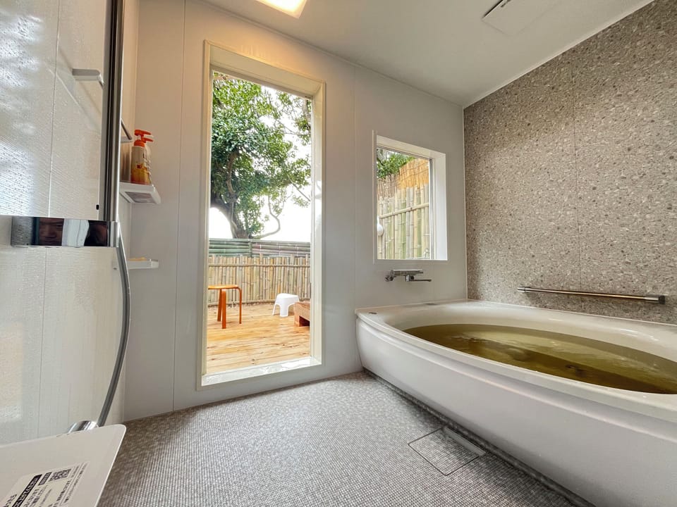 Japanese-style House, Partial Ocean View | Bathroom amenities | Combined shower/tub, hair dryer, towels, shampoo