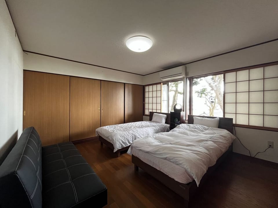 Japanese-style House, Partial Ocean View | Down comforters, desk, laptop workspace, free WiFi