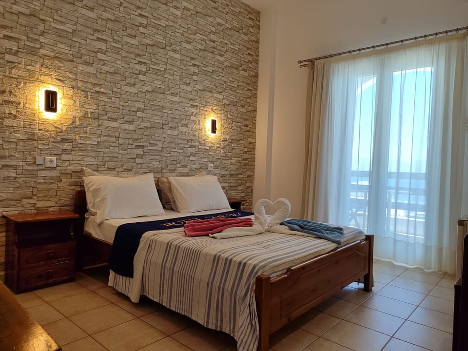 Deluxe Double Room, Balcony, Sea View | Blackout drapes, soundproofing, free WiFi