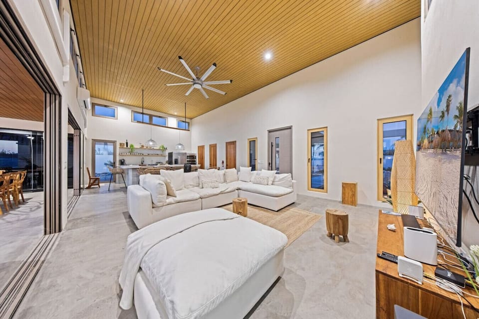 Spacious, breezy, and made for relaxing—this open-concept living room is where comfort meets island style. Perfect for movie nights, family hangouts, or just kicking back after a beach day.