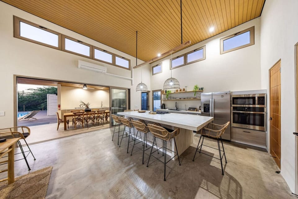 A kitchen made for gathering—spacious, stylish, and just steps from the pool. Perfect spot for morning coffee, family meals, or a casual wine night.