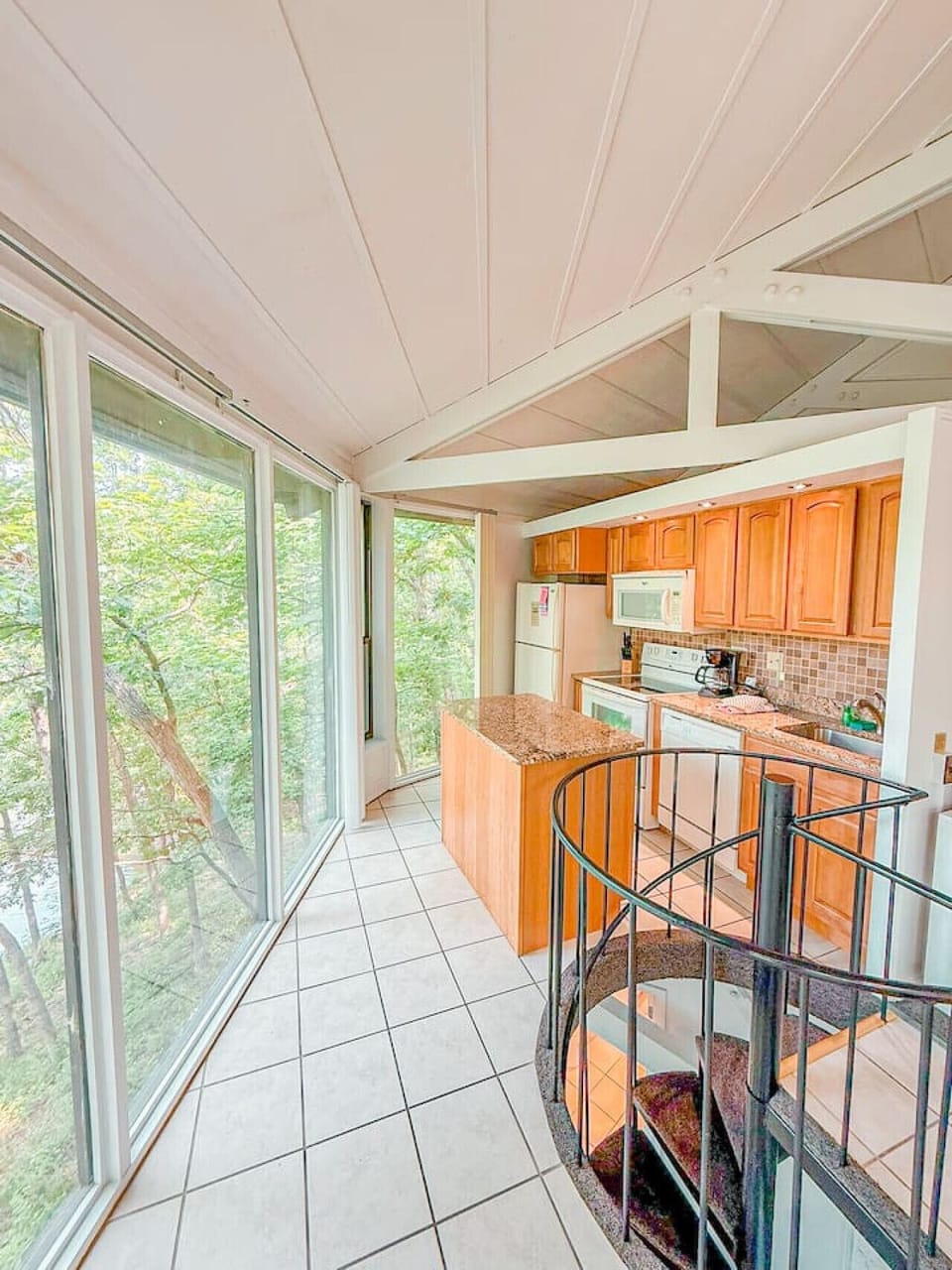 Surrounded by nature, the kitchen is as calming as it is functional—perfect for slow mornings and sunset snacks.