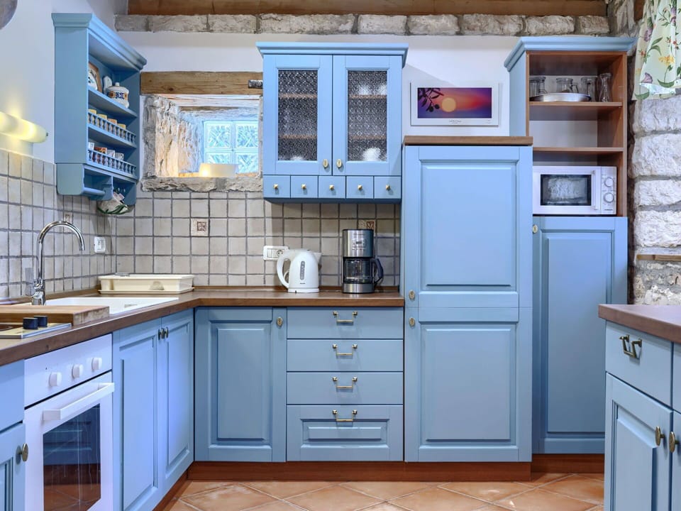 Blue, Kitchen, Cabinetry, Kitchen Appliance, Interior Design, Countertop, Wood, Major Appliance, Flooring, Drawer