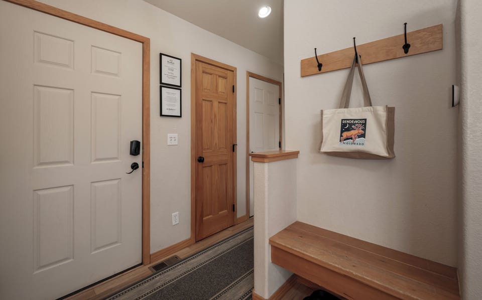 Front door entryway with space for coats and shoes